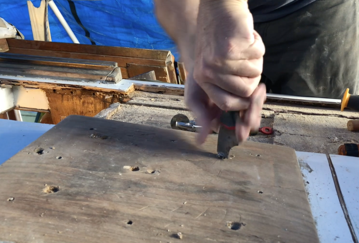 How to use a paint scraper to get screws out of wood