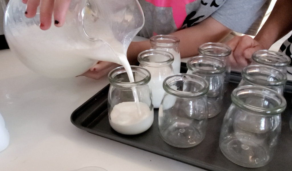 Pouring Yogurt in Jars prior to cooking